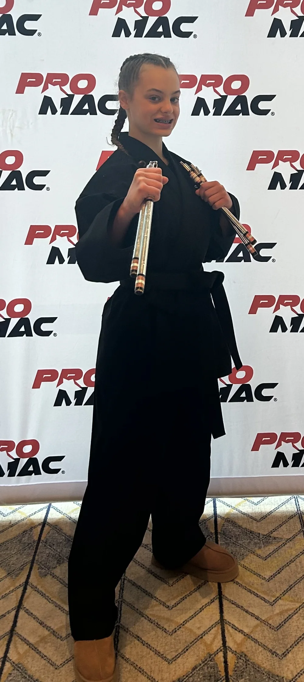Addy in her black belt martial arts uniform